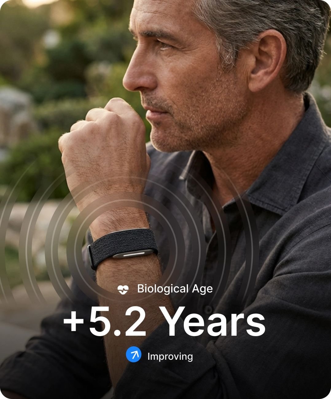 Man wearing Hume Band with biological age and illness risk visible in the app
