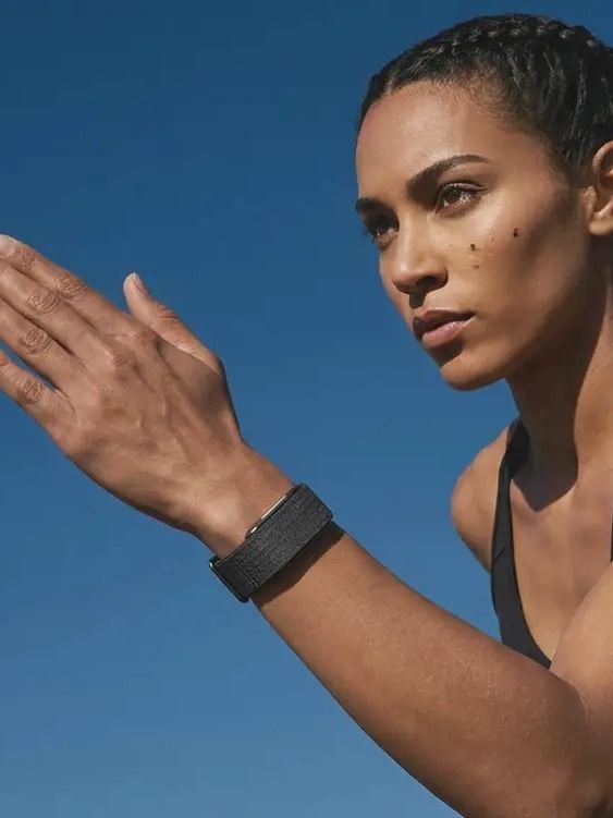 Athletic woman outdoors wearing Hume Band, building metabolic momentum